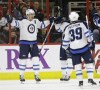 Gerry Broome / The Associated Press 
Winnipeg Jets' Blake Wheeler, left, celebrates his goal against the Carolina Hurricanes with Evander Kane, rear, and Tobias Enstrom (39) in Raleigh, N.C., Thursday.