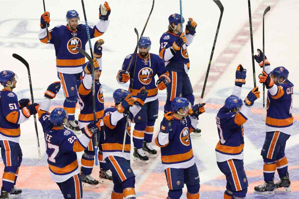 Mark Lennihan / The Associated Press
New York Islanders celebrate on the ice after defeating the Winnipeg Jets 4-2.