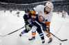 THE CANADIAN PRESS/John Woods
Winnipeg Jets' Bryan Little and New York Islanders' Adam Pelech battle for the puck during second period NHL action in Winnipeg on Thursday, March 28, 2019.
