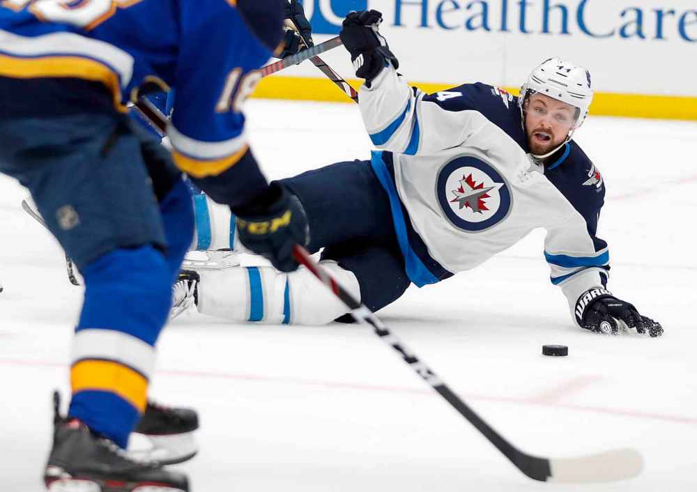 (AP Photo/Jeff Roberson)
Winnipeg Jets defenceman Josh Morrissey slides on the ice to block a shot during the second period.