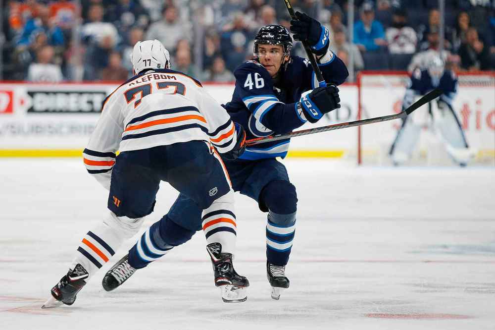 THE CANADIAN PRESS/John Woods
Winnipeg Jets left wing Joona Luoto works his way around Edmonton Oilers defenceman Oscar Klefbom during the second period.