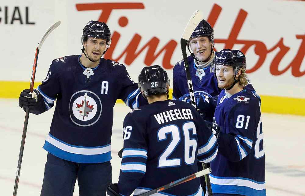 TREVOR HAGAN / WINNIPEG FREE PRESS
Winnipeg Jets' Mark Scheifele, Blake Wheeler, Patrik Laine and Kyle Connor celebrate after Laine scored a power-play goal late in the first period.