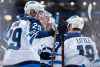THE CANADIAN PRESS/Darryl Dyck
Winnipeg Jets' Patrik Laine, left, Tyler Myers, second left, Joe Morrow, back and Bryan Little celebrate Little's goal against the Vancouver Canucks during the first period  in Vancouver, on Monday.
