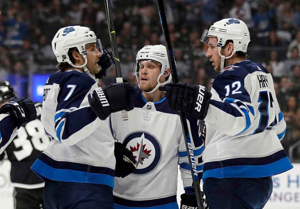 (AP Photo/Marcio Jose Sanchez)
Winnipeg Jets' Kevin Hayes, right, celebrates his goal with teammates Nikolaj Ehlers, centre, and Ben Chiarot during the first period.