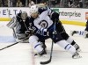 CP
Winnipeg Jets right wing Matt Halischuk goes around Los Angeles Kings goalie Jonathan Quick, railing a defender during the first period Saturday in Los Angeles.