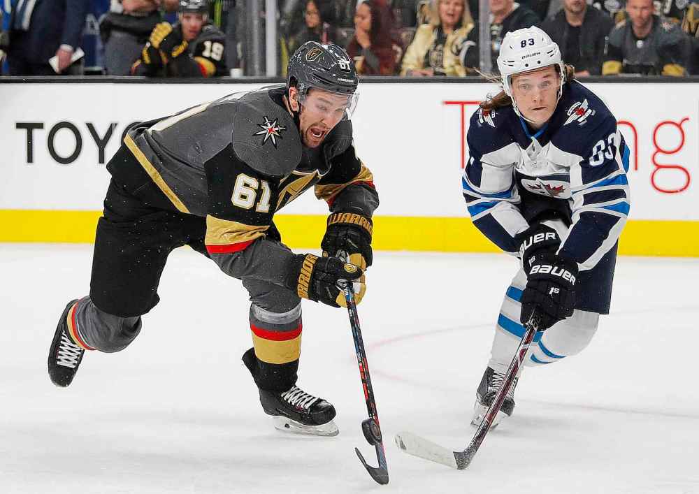 (AP Photo/John Locher)
Vegas Golden Knights right wing Mark Stone tries to evade Winnipeg Jets defenceman Sami Niku during the second period.