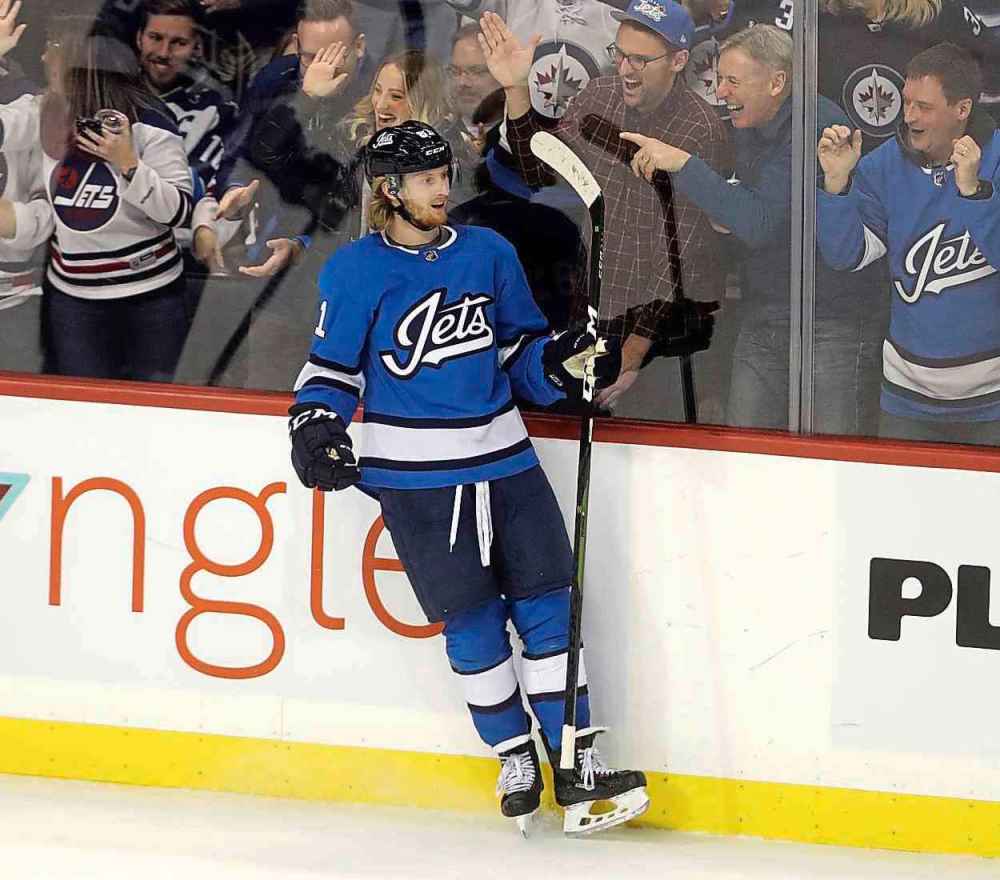 THE CANADIAN PRESS/Trevor Hagan
Jets forward Kyle Connor celebrates after scoring in Tuesday’s game against the Blackhawks. Connor finished the night with two goals, giving him three in the past two games.