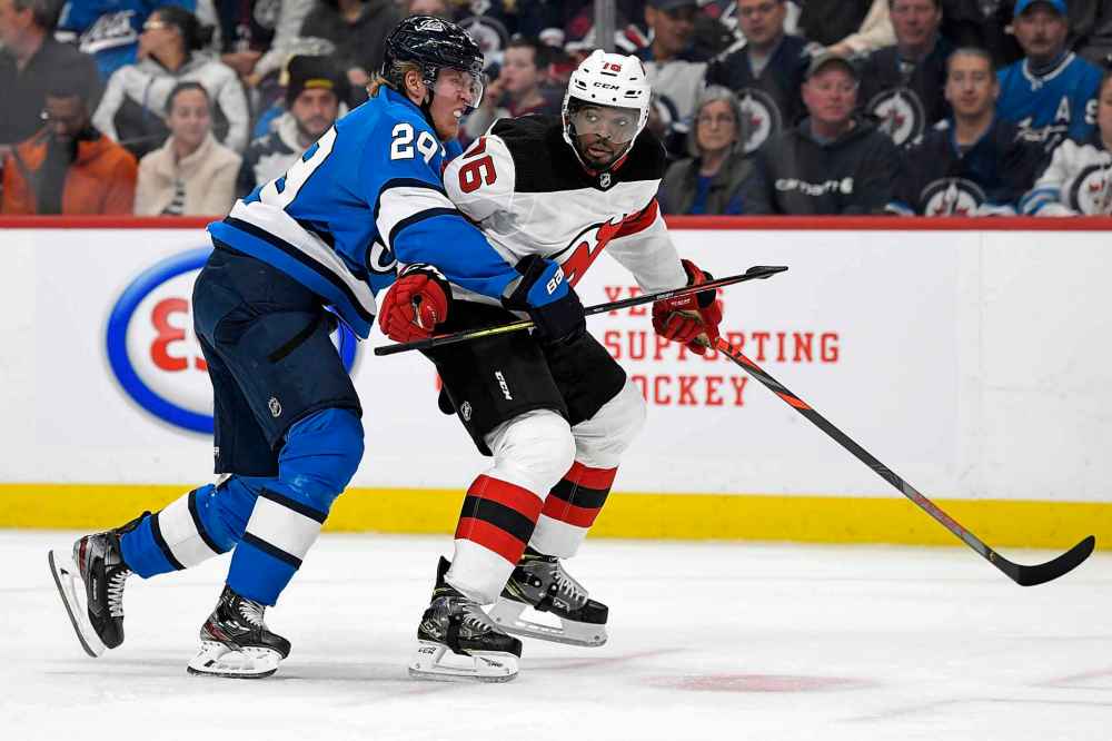 THE CANADIAN PRESS/Fred Greenslade
The Jets' Patrik Laine checks the Devils' P.K. Subban during the second period.