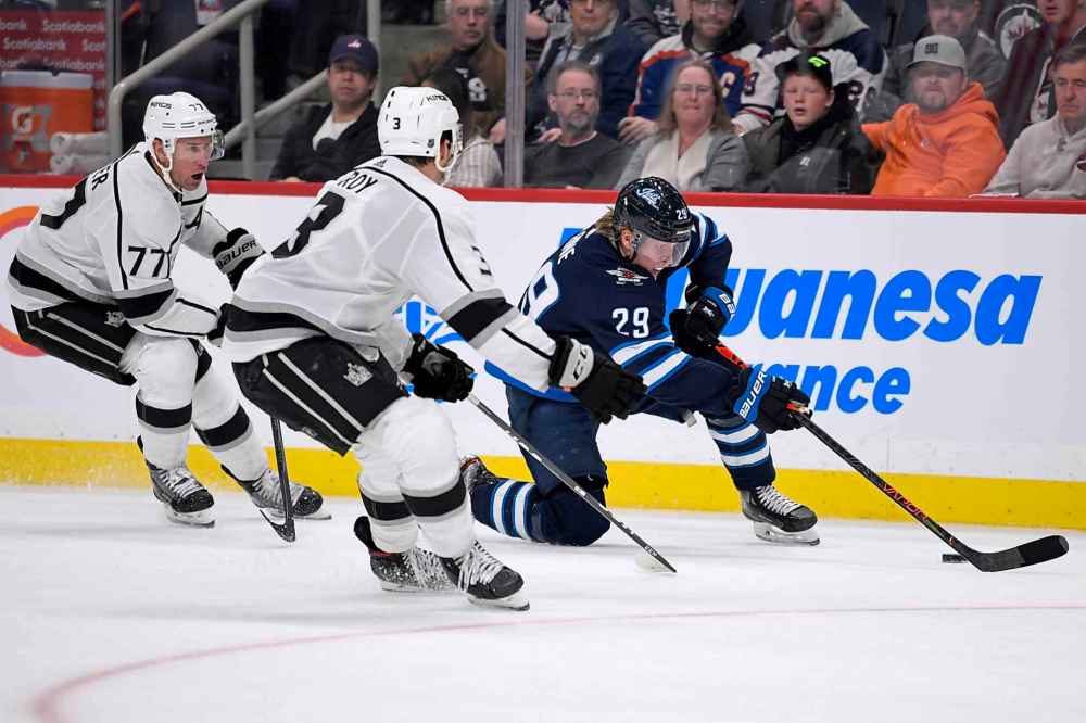 THE CANADIAN PRESS/Fred Greenslade
Winnipeg Jets' Patrik Laine carries the puck past Los Angeles Kings' Jeff Carter and Matt Roy during the second period.