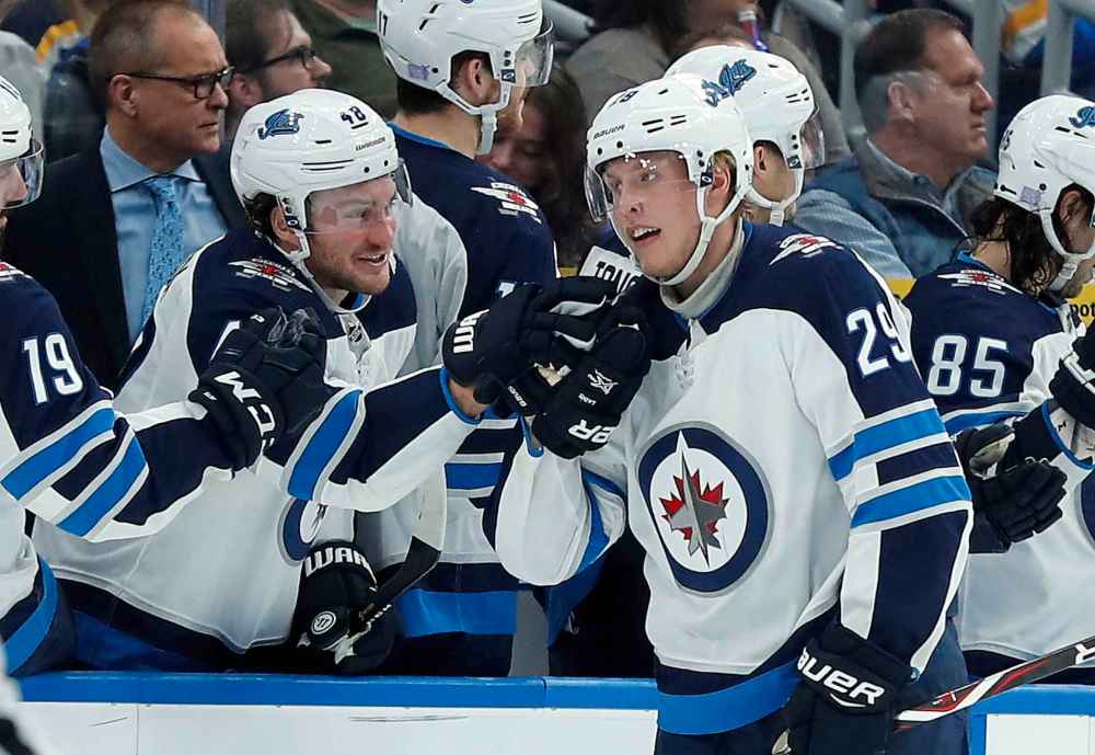 (AP Photo/Jeff Roberson)
Winnipeg Jets' Patrik Laine (29), of Finland, is congratulated by Brendan Lemieux after scoring during the second period of an NHL hockey game against the St. Louis Blues, Saturday, Nov. 24, 2018, in St. Louis.