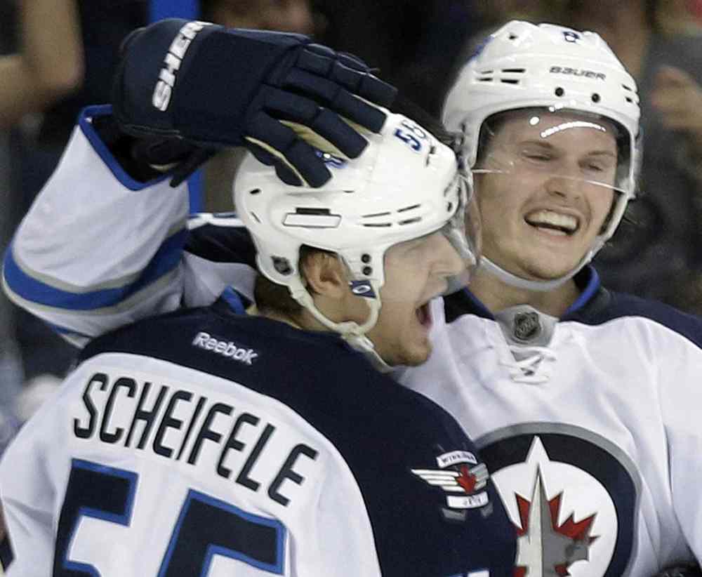 Chris O'Meara / The Associated Press
Winnipeg Jets centre Mark Scheifele and blue-liner Jacob Trouba are making a big impact in the NHL.