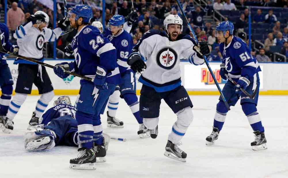 Mike Carlson / The Associated Press
Winnipeg Jets' Mathieu Perreault celebrates his goal.