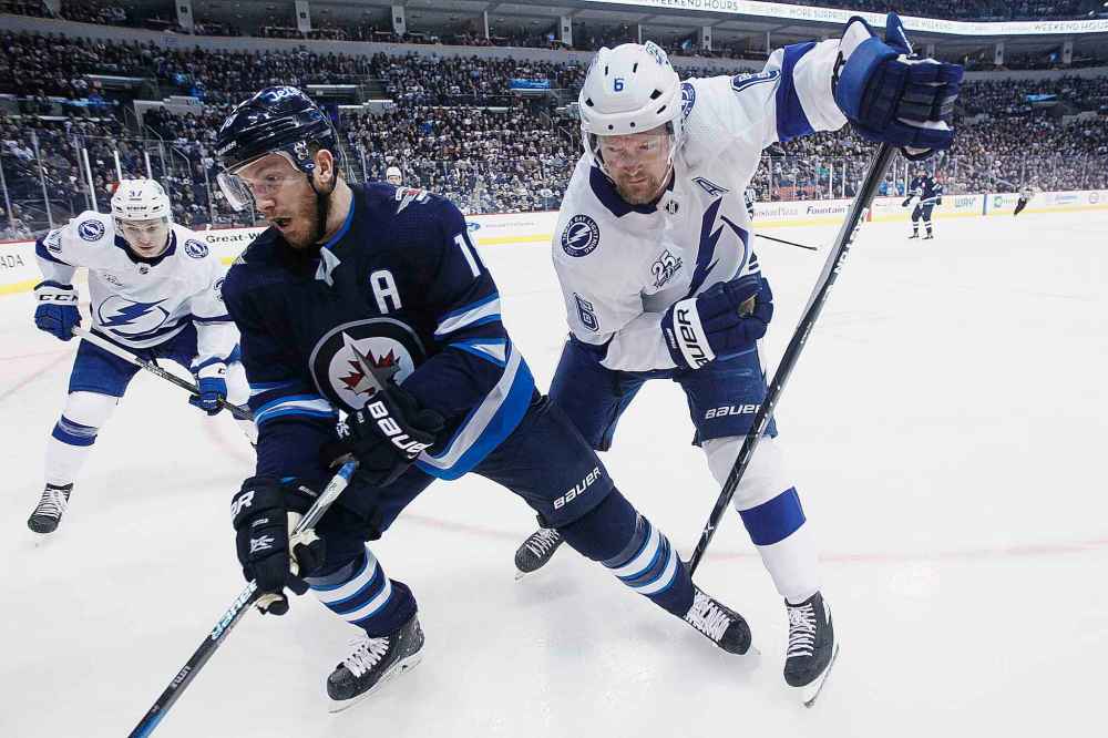 JOHN WOODS / WINNIPEG FREE PRESS FILES
Winnipeg Jets' Bryan Little and Tampa Bay Lightning's Anton Stralman battle for the puck last season. Seven of the Jets next 12 games are against teams currently occupying a playoff spot, including a date with the league-leading Lightning on Sunday.