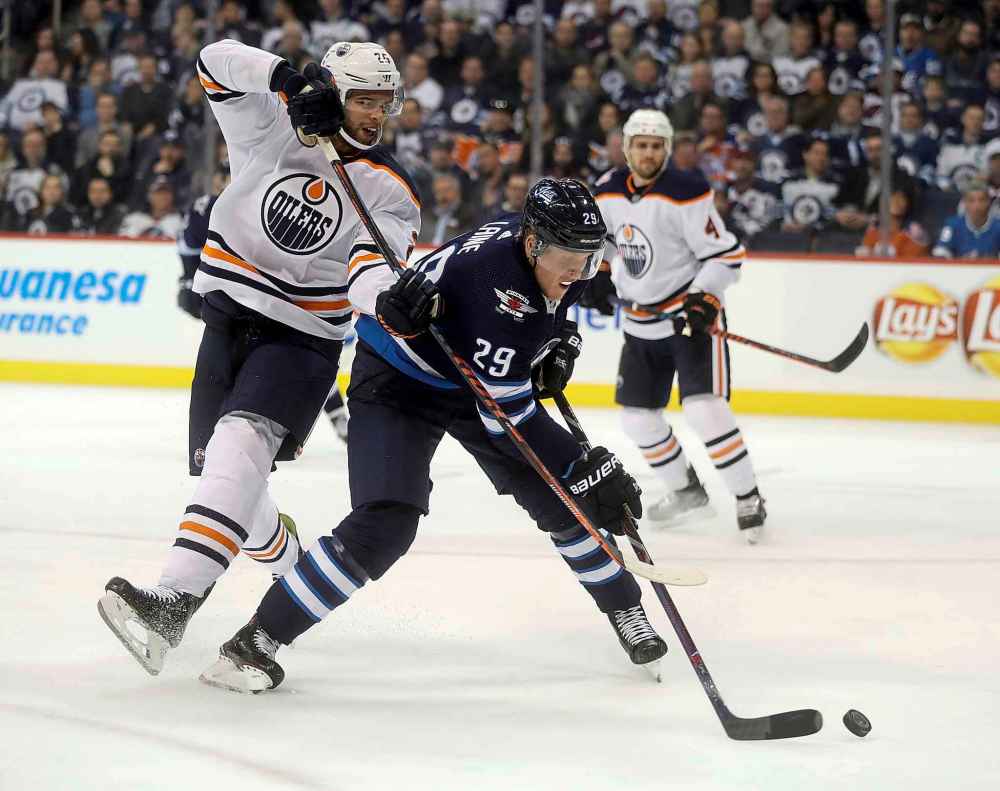 THE CANADIAN PRESS/Trevor Hagan
Winnipeg Jets' Patrik Laine moves around Edmonton Oilers' Darnell Nurse the last time the two teams met in October. Since then, the resurgent Oilers have hired a new head coach in Ken Hitchcock and compiled a record of 8-2-1.