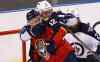 CP
Winnipeg Jets' Jacob Trouba (8) wrestles Florida Panthers' Jimmy Hayes (12) away from the net during the first period of Thursday's game.