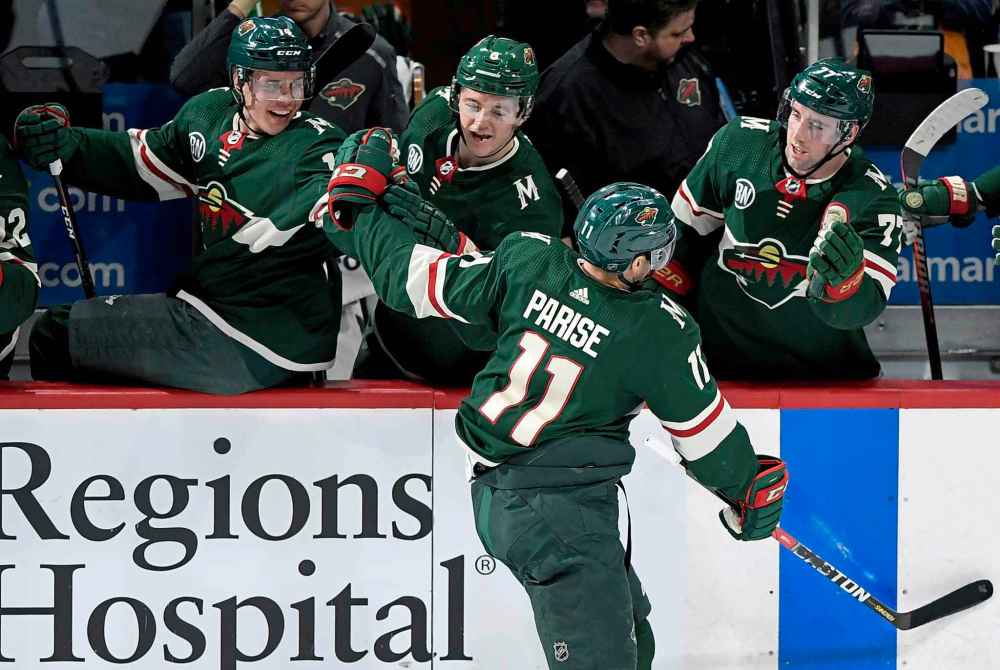 (AP Photo/Hannah Foslien)
Minnesota Wild celebrate Zach Parise's second goal of the night against the Winnipeg Jets during the first period Tuesday, in St. Paul, Minn.