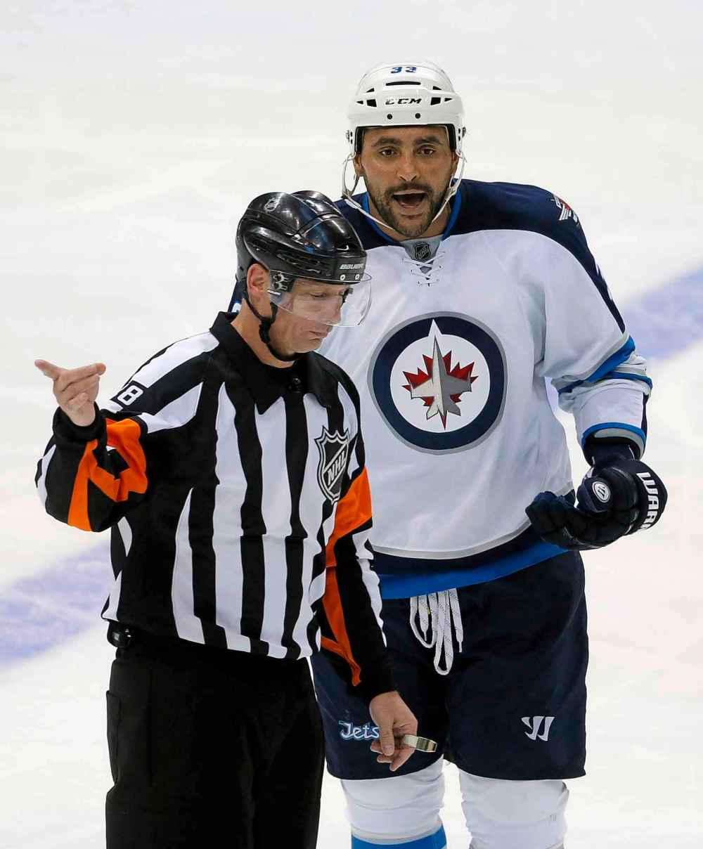 (AP Photo/Tony Gutierrez)
Referee sends Winnipeg Jets' Dustin Byfuglien to the penalty box in 2015.
