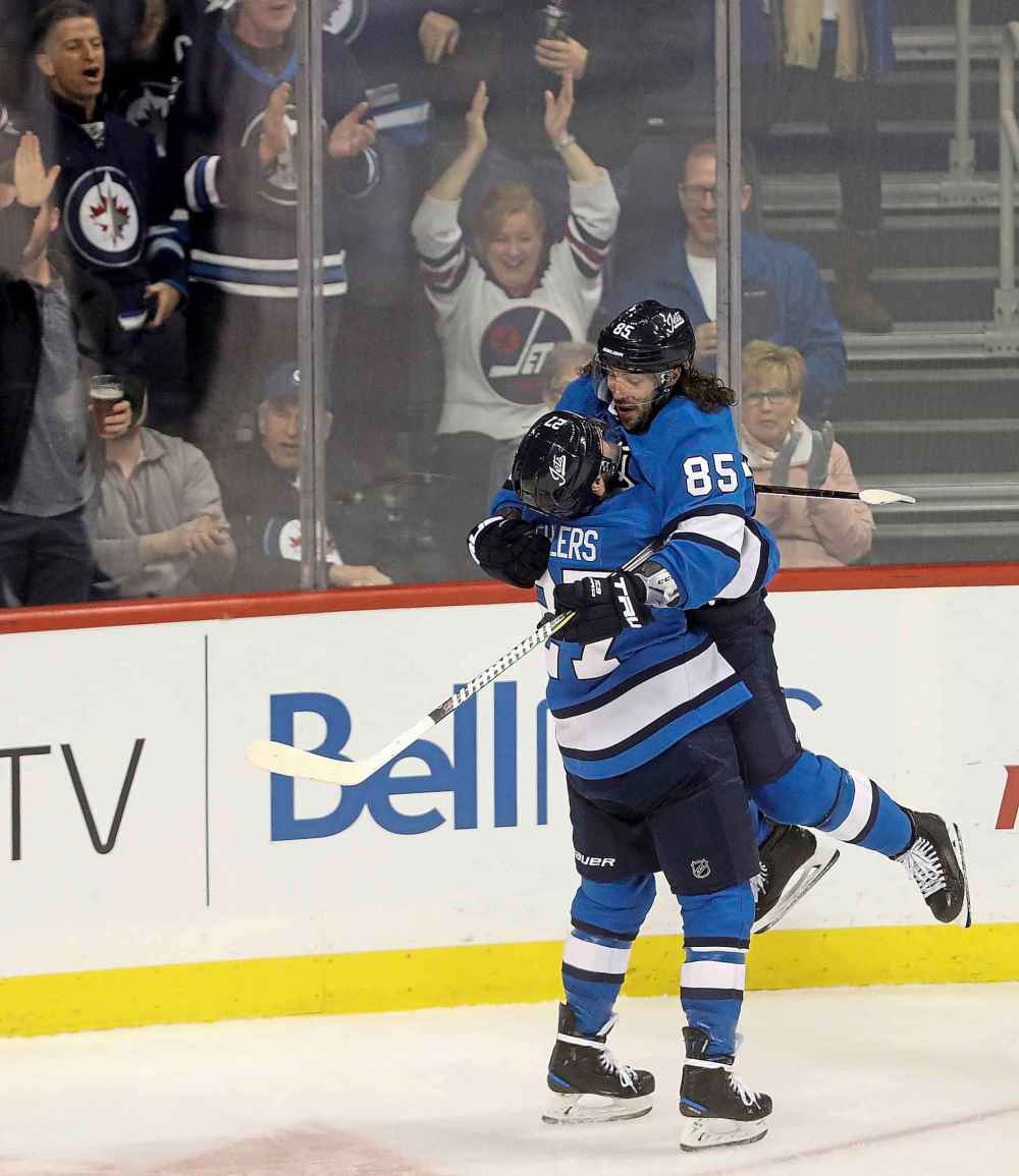 THE CANADIAN PRESS/Trevor Hagan
Winnipeg Jets' Nikolaj Ehlers lifts Mathieu Perreault as they celebrate Perreault's goal against the Chicago Blackhawks' during third period, Tuesday.