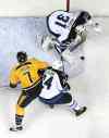 Mark Humphrey / The Associated Press
Winnipeg goalie Ondrej Pavelec blocks a shot as Jets D-man Grant Clitsome steers Nashville forward Matt Cullen away from the rebound.