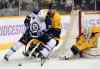 Mark Zaleski / The Associated Press
Evander Kane brings the puck around the net as he is shadowed by Nashville Predators defenceman Shea Weber in Nashville.