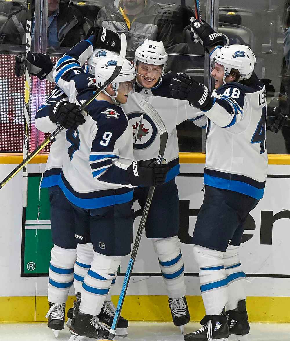 (AP Photo/Mark Zaleski)
Winnipeg Jets centre Mason Appleton celebrates with teammates after scoring a goal against the Nashville Predators during the second period.