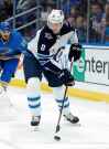 CP
Winnipeg Jets' Jacob Trouba (8) passes the puck as St. Louis Blues goaltender Chad Johnson, left, and Robby Fabbri defend during the first period of an NHL hockey game Saturday, Nov. 24, 2018, in St. Louis. (AP Photo/Jeff Roberson)