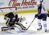 David Duprey / the associated press
Buffalo Sabres goalie Jhonas Enroth makes a save on a shot by Winnipeg Jets forward Eric Tangradi during the first period of an NHL game in Buffalo, N.Y., Monday.
