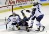 David Duprey / The Associated Press
Sabres' Tyler Ennis battles for the puck with Jets' Ron Hainsey and Mark Stuart in front of Winnipeg goaltender Ondrej Pavelec in Buffalo on Monday night.