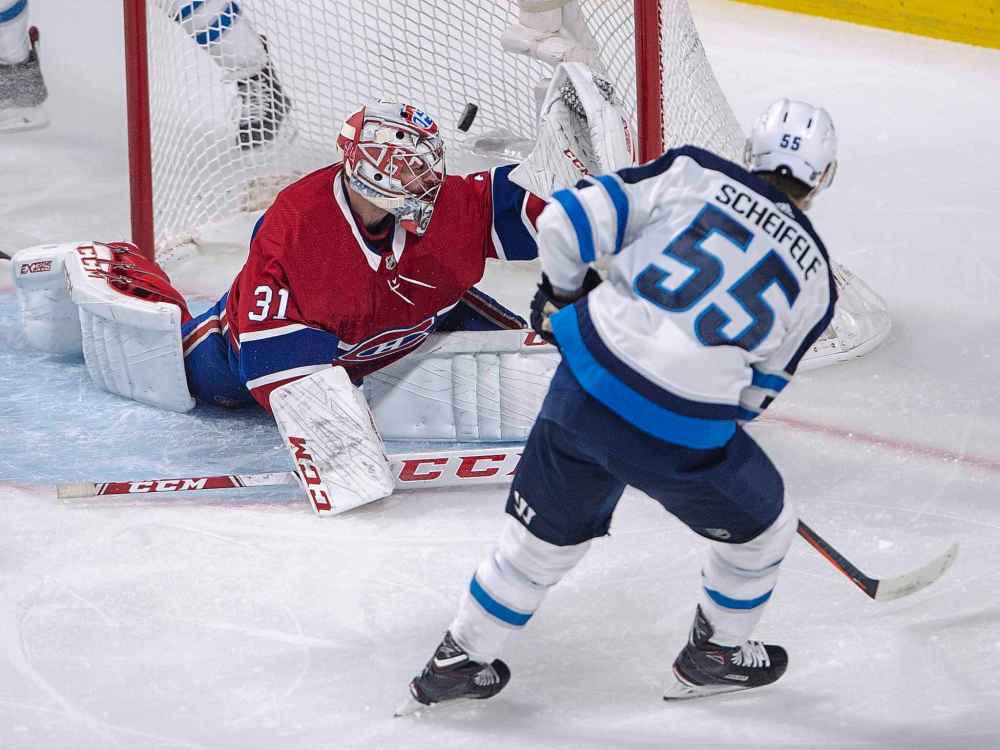 THE CANADIAN PRESS/Ryan Remiorz
Winnipeg Jets centre Mark Scheifele scores on Montreal Canadiens goaltender Carey Price during the first Thursday in Montreal.