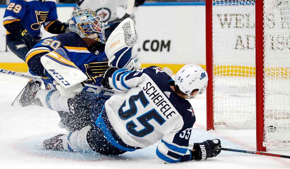 (AP Photo/Jeff Roberson)
St. Louis Blues goaltender Jordan Binnington looks back into the net after Winnipeg Jets centre Mark Scheifele scored during the third period.