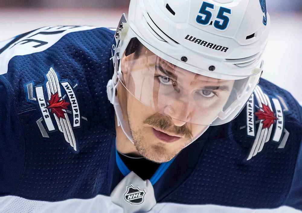 THE CANADIAN PRESS/Darryl Dyck
Winnipeg Jets' Mark Scheifele lines up for a faceoff against the Vancouver Canucks during the first period Monday.