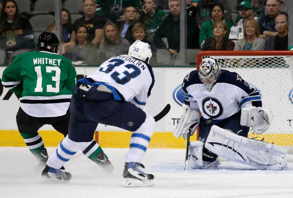 Tony Gutierrez / The Associated Press
Winnipeg Jets goalie Ondrej Pavelec (right) blocks a shot from Dallas Stars winger Ray Whitney as Jets defenceman Dustin Byfuglien backchecks during the first period Saturday night's game in Dallas.