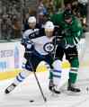 Tony Gutierrez / The Associated Press
Winnipeg Jets center Olli Jokinen fights off Dallas Stars defenceman Brenden Dillon during the second period.