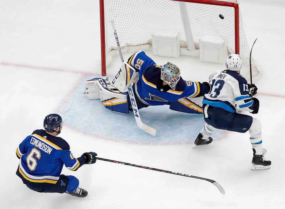 (AP Photo/Jeff Roberson)
St. Louis Blues goaltender Jordan Binnington blocks a shot by Winnipeg Jets left wing Brandon Tanev during the second period in Game 4.