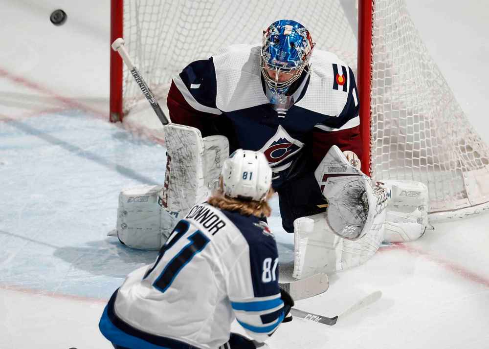 (AP Photo/David Zalubowski)
Colorado Avalanche goaltender Semyon Varlamov deflects a shot off the stick of Winnipeg Jets left wing Kyle Connor in the first period.