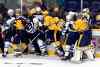 Mark Zaleski / The Associated Press
Linesman Andy McElman (90) tries to break up a fight between the Nashville Predators and the Winnipeg Jets in the third period Saturday in Nashville. The Predators won 7-0.
