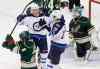 Jim Mone / The Associated Press
Winnipeg Jets' Bryan Little (18) and Andrew Ladd (16) celebrate Little's first-period power-play goal off Minnesota Wild goalie Josh Harding (right), as Zenon Konopka (lower left) swings his stick toward the ice in frustration.