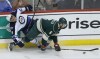 ANN HEISENFELT / THE ASSOCIATED PRESS
Jets left-winger Evander Kane is taken out by Minnesota Wild defenceman Marco Scandella Sunday night in St. Paul.