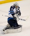 Ann Heisenfelt / The Associated Press 
Winnipeg Jets goalie Connor Hellebuyck stops a shot by the Minnesota Wild during the first period of an NHL hockey game in St. Paul, Minn., Friday.