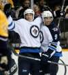 CP
Winnipeg Jets right wing Spencer Machacek, left, celebrates with Evander Kane after scoring against the Nashville Predators in the first period of a preseason NHL hockey game on Saturday, Sept. 24, 2011, in Nashville, Tenn. (AP Photo/Mark Humphrey)