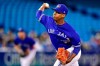 Toronto Blue Jays relief pitcher Elvis Luciano (65) works against the Detroit Tigers during seventh inning American League baseball action in Toronto on Sunday, March 31, 2019. Luciano became the youngest pitcher in Toronto history when he debuted Sunday against the Detroit Tigers. Luciano, who turned 19 on Feb. 15, allowed one hit in 1 1/3 scoreless innings. THE CANADIAN PRESS/Frank Gunn