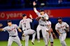 Detroit Tigers right fielder Nicholas Castellanos, centre, celebrates with teammates after defeating the Toronto Blue Jays following American League baseball action in Toronto on Sunday, March 31, 2019. THE CANADIAN PRESS/Frank Gunn