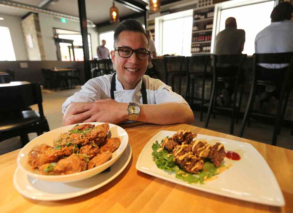 Jason Halstead / Winnipeg Free Press
Executive chef/partner Norm Pastorin with chicken wings, left, and steak bites.
