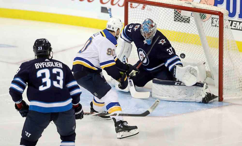 THE CANADIAN PRESS/Trevor Hagan
St. Louis Blues' Ryan O'Reilly scores on Winnipeg Jets goaltender Connor Hellebuyck during the first period Monday.