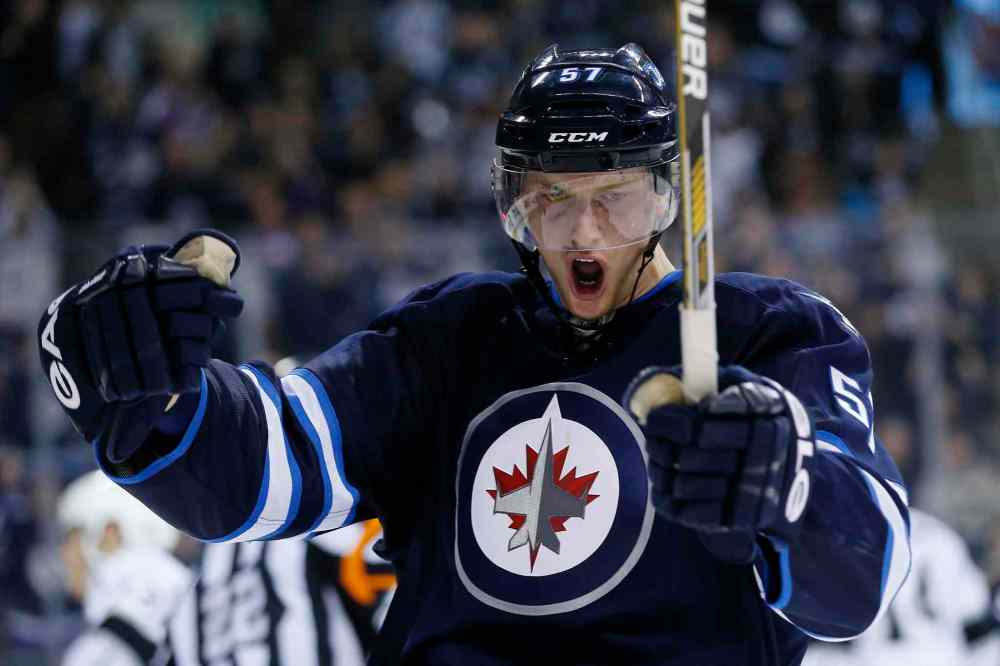 JOHN WOODS / FREE PRESS files
Tyler Myers slid into the boards in an awkward manner during the second period of Thursday’s 4-2 loss to the Florida Panthers and did not return to the game.