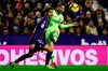 Levante's defender Jose Gomez Campana, left, in action against FC Barcelona's forward Lionel Messi, right, during their La Liga soccer match between Levante UD and FC Barcelona at Ciutat de Valencia stadium in Valencia, Spain, Sunday, Dec. 16, 2018. (AP Photo/Jose Miguel Fernandez de Velasco)