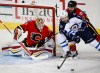 Winnipeg Jets' Drew Stafford, centre, tries for a lose puck as Calgary Flames' Deryk Engelland defends and goalie Joni Ortio, left, from Finland, looks on during first period NHL hockey action in Calgary, Wednesday, March 16, 2016.THE CANADIAN PRESS/Jeff McIntosh