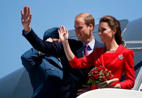 The Duke and Duchess of Cambridge wave from their plane before departing from their cross-Canada tour in Calgary, Alta., Friday, July 8, 2011.THE CANADIAN PRESS/Jeff McIntosh