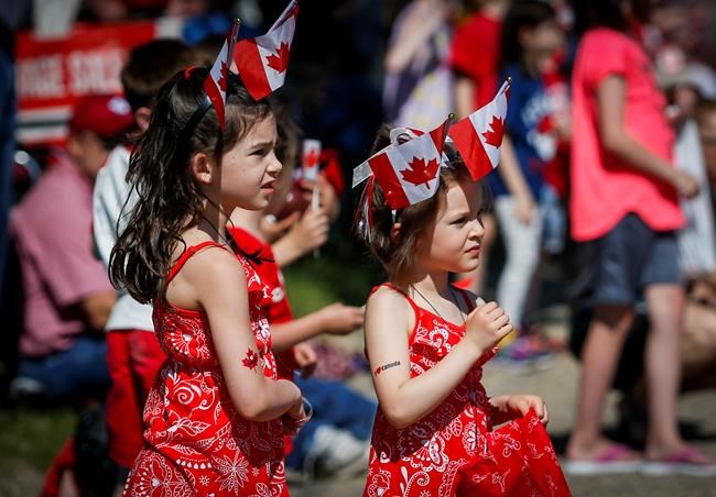 Children watch a parade during Canada Day celebrations in Cremona, Alta., Monday, July 1, 2019.THE CANADIAN PRESS/Jeff McIntosh