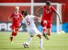 Canada's Christine Sinclair, right, jumps past China's Wu Haiyan during FIFA Women's World Cup soccer action in Edmonton, Alta., Saturday, June 6, 2015.THE CANADIAN PRESS/Jeff McIntosh